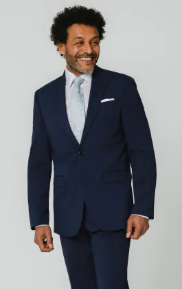 Blauw kostuum met piek revers